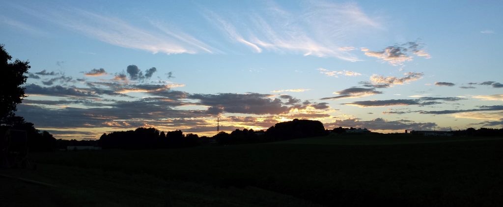 Cloud formations and reflection at sunset