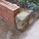 Completing the wall for the rock garden against the shed