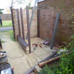 Attaching the main posts to the brickwork