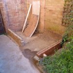 The low brick walls laid and ready for the post attachment