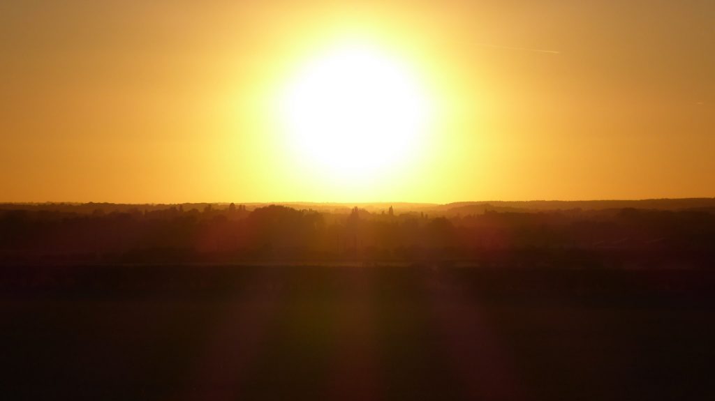 Silhouetted land sunset