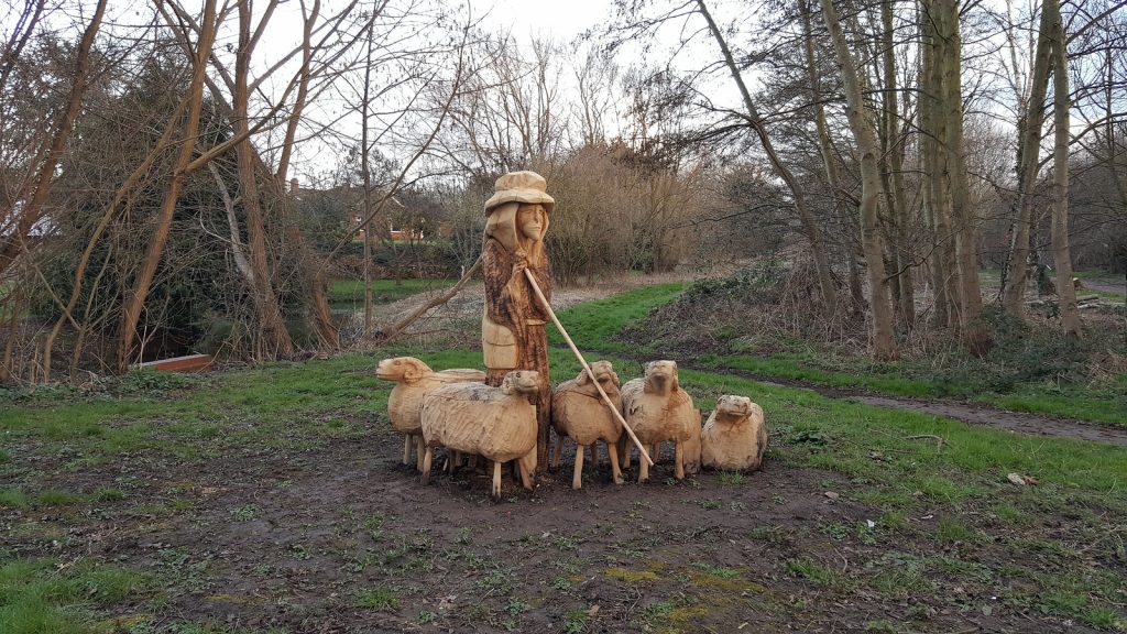 Shepherd and sheep sculpture